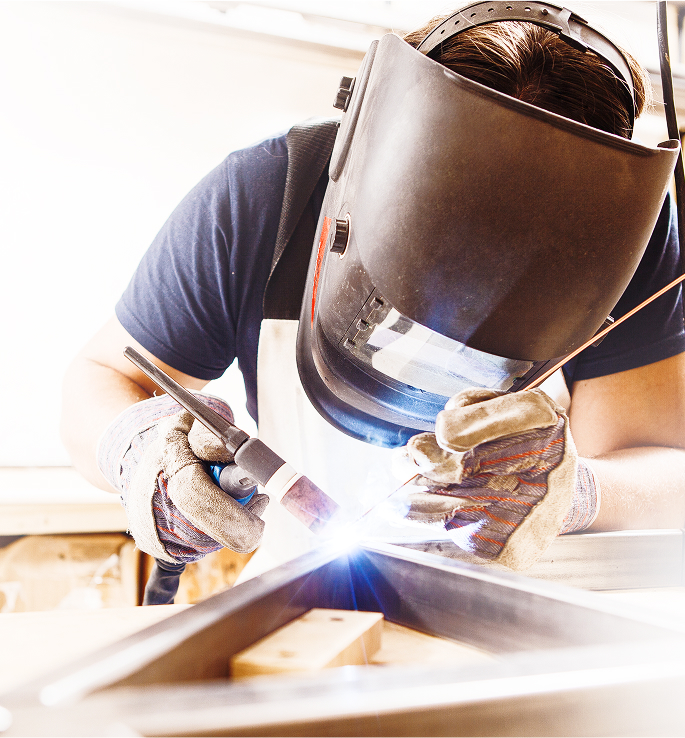 Technician welding custom magnetic solutions