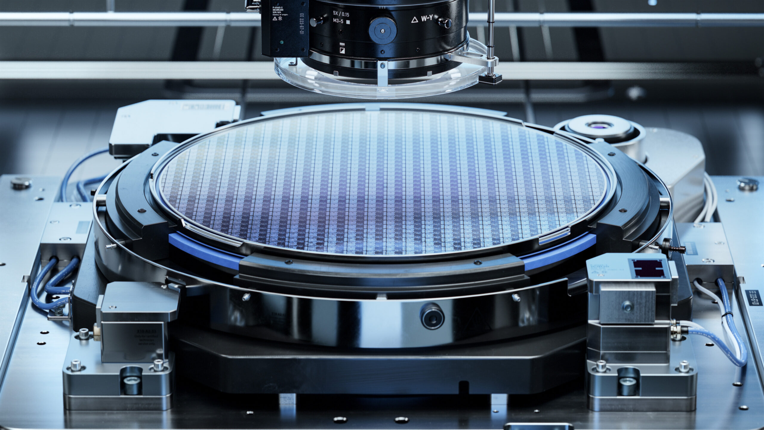 Silicon Wafer during Photolithography Process. Shot of Lithography Process that allows to Create Complex Patterns on a Wafer during Semiconductor and Computer Chip Manufacturing at Fab or Foundry.